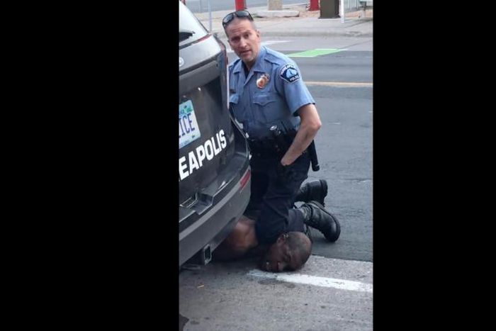 A Minneapolis police officer holds his knee to the neck of George Floyd, who died in police custody.
