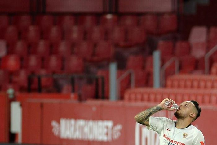 Thirsty work: Sevilla's Argentinian midfielder Lucas Ocampos drinks water during the game with Mallorca