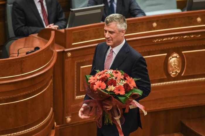 Newly elected President of Kosovo Hashim Thaci holds flowers during an extraordinary session in Pristina on February 26, 2016 Kosovo MPs elected foreign minister and former premier Hashim Thaci as president on February 26 after a tense day of voting ma...