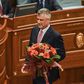 Newly elected President of Kosovo Hashim Thaci holds flowers during an extraordinary session in Pristina on February 26, 2016 Kosovo MPs elected foreign minister and former premier Hashim Thaci as president on February 26 after a tense day of voting ma...