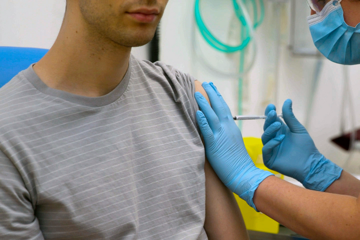 In this screen grab from video issued by Britain's Oxford University, a volunteer is injected with either an experimental COVID-19 vaccine or a comparison shot as part of the first human trials in the U.K. to test a potential vaccine, led by Oxford Uni...