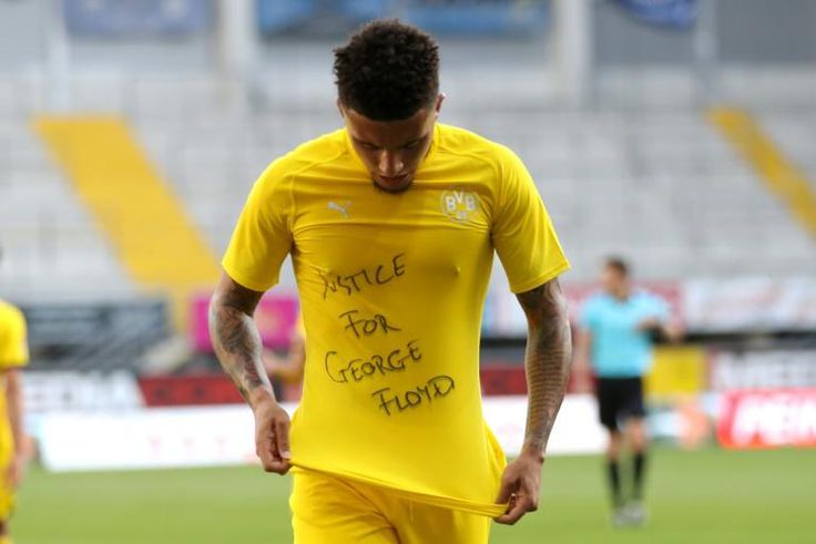 Borussia Dortmund's Jadon Sancho shows a "Justice for George Floyd" shirt as he celebrates after scoring on Sunday