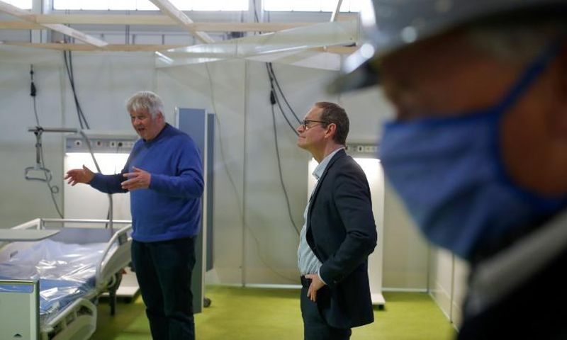 Wires are still hanging from the ceilings, but  the vast Berlin site will soon be able to host up to 1,000 patients