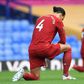 Liverpool's Virgil van Dijk (left) takes a knee as all Premier League players showed their support for the Black Lives Matter campaign