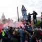 Fans cheer as the Liverpool team bus arrives at Anfield