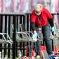 A member of staff cleans the substitute bench during half time of RB Leipzig's draw with Hertha Berlin