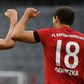 Leon Goretzka (R) celebrates scoring the opening goal with Bayern Munich striker Robert Lewandowski.
