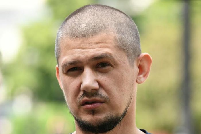 Former neighbourhood police inspector Georgy Zarya amarched to the Moscow police headquarters in May holding a sign urging the city's police chief to resign