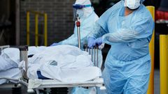 new york city nyc coronavirus covid 19 body bag hospital temporary morgue nurse gurney AP_20097795630696