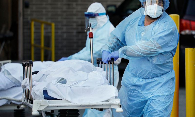 new york city nyc coronavirus covid 19 body bag hospital temporary morgue nurse gurney AP_20097795630696