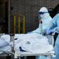 new york city nyc coronavirus covid 19 body bag hospital temporary morgue nurse gurney AP_20097795630696
