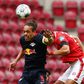 Leipzig's Danish forward Yussuf Poulsen (L) scored and set up two more goals against Mainz on Sunday despite suffering torn ankle ligaments.