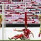 Is there anybody there? Benfica's Moroccan midfielder Adel Taarabt protests during the Portuguese league match against CD Tondela in front of a wall of scarves in the absence of spectators