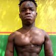 Shatta Bandle flaunts six packs