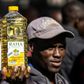 Inflation anger: A protester holds a bottle of cooking oil during a demonstration in Harare last August over the cost of food