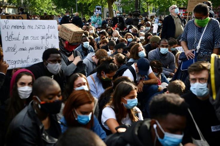 Those attending the meeting at one point took the knee in solidarity with the movement protesting police violence in the United States