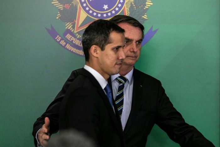 Brazil's President Jair Bolsonaro (right) supports the claim of Venezuelan opposition leader and self-declared acting president Juan Guaido