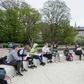 Teacher Marie Kaas-Larsen speaks with her pupils of the Norrebro Park primary school outside in a nearby park in Copenhagen, Denmark