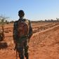 A Niger soldier looks at the graves of 71 Niger troops soldiers killed  in a jihadist attack on December 10, 2019, ahead of a regional summit to coordinate a response to the growing unrest.