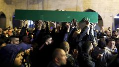 Thousands of mourners attended the funeral of Iyad Hallak