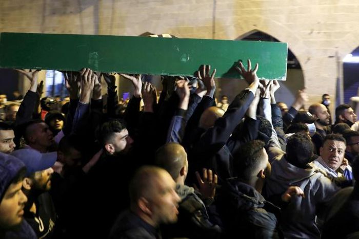 Thousands of mourners attended the funeral of Iyad Hallak