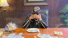 Medikal flaunts wads of dollars on social media