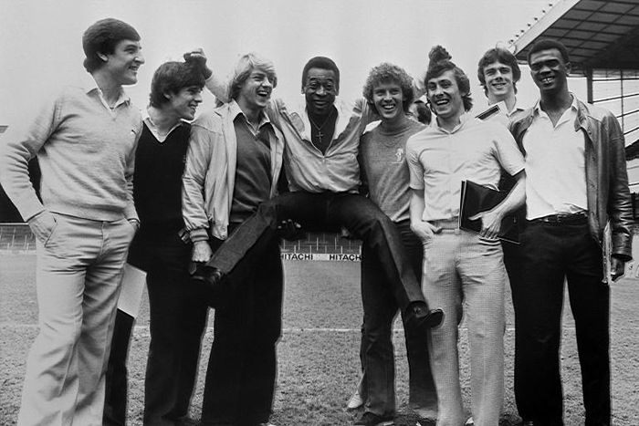 Kenny Sansom (third from right) is pictured with Brazilian great Pele and some of his Arsenal teammates at Highbury Stadium in London in May 1981