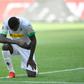 Moenchengladbach's French forward Marcus Thuram  took a knee after scoring