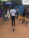 Waakye seller and her customers