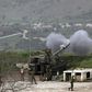 Israeli soldiers take part in a mobile artillery exercise near the border with Syria in the Israeli-occupied Golan Heights on April 5, 2020