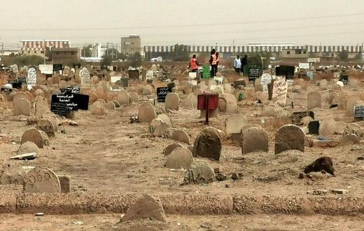 A picture taken on June 13, 2020, shows members of a forensic team at a cemetery where a mass grave of conscripts killed in 1998 was discovered, in the Sahafa neighbourhood, south of the Sudanese capital Khartoum