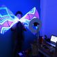 Magician Gustavo Pintos shakes a light-stick as he performs for an online birthday party hundreds of kilometers away from his home in Buenos Aires