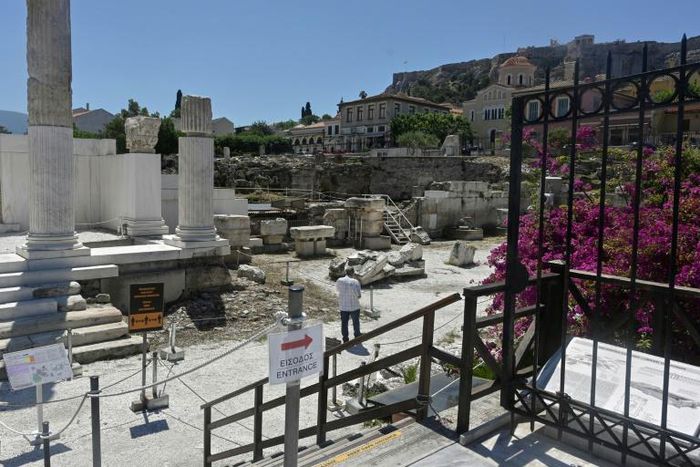 A man walks at the archaeological site of Hadrian's library in Athens as Greece eases lockdown measures taken to curb the spread of  COVID-19