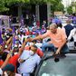 Ruling Dominican Liberation Party (PLD) candidate Gonzalo Castillo shakes hands with supporters in San Pedro de Macoris ahead vote