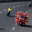 A health worker drives an auto-rickshaw decorated as a coronavirus model to raise awareness about the pandemic in Chennai, India