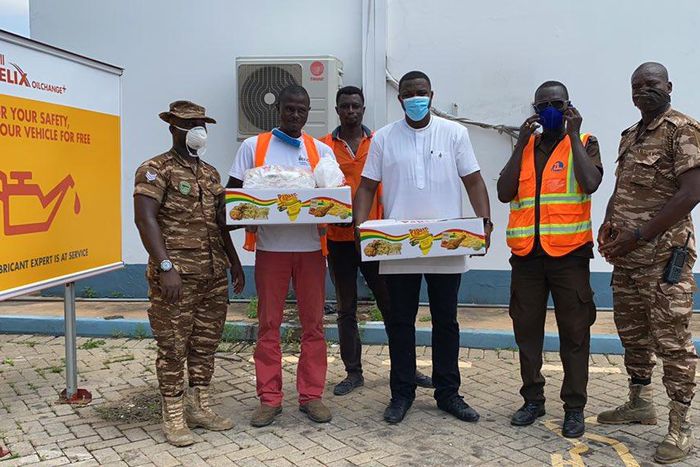 Photos: John Dumelo offers lunch to prisoners weeding on Legon-Shiashie Highway