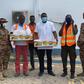 Photos: John Dumelo offers lunch to prisoners weeding on Legon-Shiashie Highway