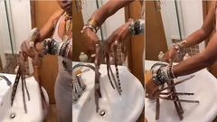 Woman with 16 inches long fingernails demonstrates how she manages to wash her hands (video)