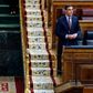 Spanish Prime Minister Pedro Sanchez speaks from his seat during a session to debate the extension of a national lockdown to curb the spread of the novel coronavirus at the Lower Chamber of the Spanish parliament in Madrid