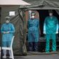 Medical staff at Mohammmed V military hospital wear protective masks and caps as they wait for patients in the Moroccan capital Rabat