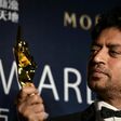 Irrfan Khan poses with a statuette for Best Actor at the 2014 Asian Film Awards