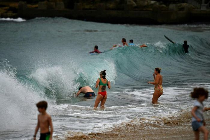 Authorities in Sydney have reopened some beaches for walking, running, swimming and surfing