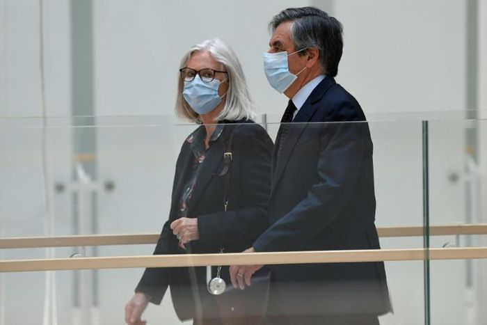 Former French prime minister Francois Fillon and his wife Penelope arriving at the Paris courthouse on Monday.