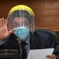 Judge Miguel Angel Galvez wears a face shield and a mask during a hearing against Guatemalan ex-president Otto Perez in Guatemala City on May 12, 2020