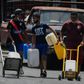 A man carries water in Caracas May 19, 2020 amid the coronavirus pandemic