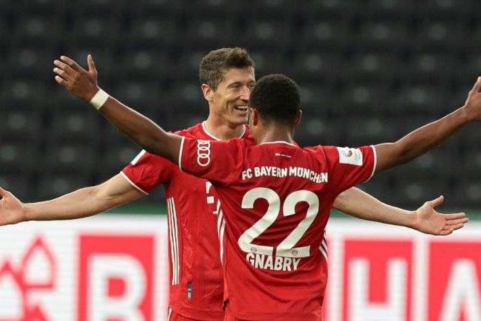 Bayern Munich striker Robert Lewandowski celebrates his long-range goal in the German Cup final win over Bayer Leverkusen on Saturday in Berlin.