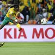 Siphiwe Tshabalala (R) from hosts South Africa scores the first goal of the 2010 World Cup, against Mexico in a drawn group match