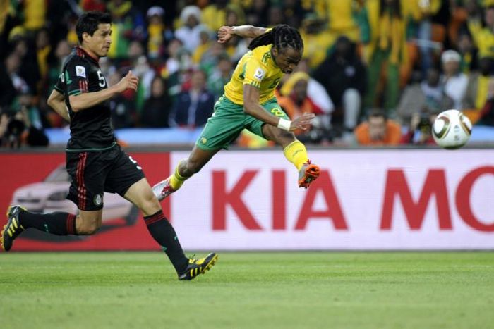 Siphiwe Tshabalala (R) from hosts South Africa scores the first goal of the 2010 World Cup, against Mexico in a drawn group match