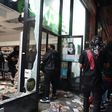 Looters hit stores in New York where the mayor has imposed an overnight curfew