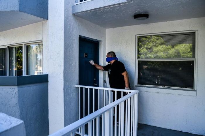 Mario Amate, who used to work as an Uber driver and recently found himself unemployed, knocks on a door to deliver homemeade tequenos, a popular Venezuelan snack, to a customer